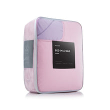 Load image into Gallery viewer, lilac reversible bed in a bag packaging