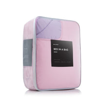 Load image into Gallery viewer, lilac reversible bed in a bag packaging
