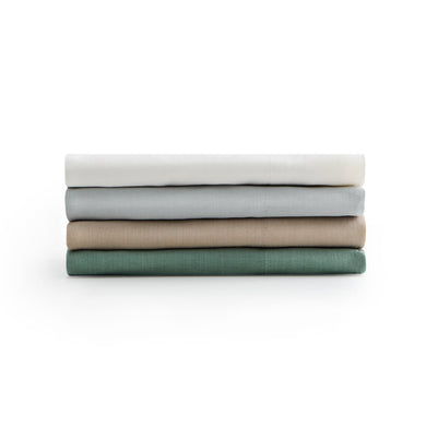 Stack of Malouf Linen Weave Cotton Sheets
