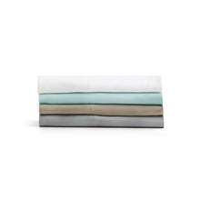 Load image into Gallery viewer, a stack of folded Malouf Bamboo Rayon Sheet Set
